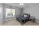 Cozy bedroom featuring a window for natural light and neutral paint at 101 Mantle Dr, Clayton, NC 27527
