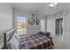 Bedroom with neutral paint, wainscotting, and ensuite bathroom at 101 Mantle Dr, Clayton, NC 27527