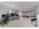 Finished basement game room features neutral walls and carpet and natural lighting at 101 Mantle Dr, Clayton, NC 27527