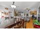 Spacious open-concept living area featuring wood floors, a dining area, and an office space at 101 Mantle Dr, Clayton, NC 27527