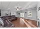 Living room features fireplace, laminate wood flooring, and access to basement entrance at 101 Mantle Dr, Clayton, NC 27527