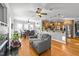 Open-concept living space showcasing a fireplace, dining area, and kitchen with hardwood flooring at 101 Mantle Dr, Clayton, NC 27527
