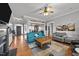 Open living room featuring hardwood floors, fireplace, and stylish furniture at 101 Mantle Dr, Clayton, NC 27527