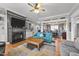 Bright living area with a fireplace, built-ins, and cozy seating at 101 Mantle Dr, Clayton, NC 27527