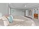 Light-filled main bedroom features tray ceiling, decor, and an ensuite bathroom at 101 Mantle Dr, Clayton, NC 27527