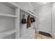 Convenient mudroom area with built-in shelving and coat hooks for organization and storage at 101 Mantle Dr, Clayton, NC 27527