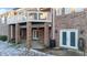 Lower level patio with brick supports offers a shady, versatile outdoor space with ample natural light at 101 Mantle Dr, Clayton, NC 27527