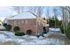 Exterior rear view of brick home with walk out basement and landscaped yard at 101 Mantle Dr, Clayton, NC 27527
