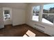 Sunlit bedroom with hardwood floors and large windows overlooking the trees at 1101 Sunset Ave, Rocky Mount, NC 27804