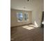 Sunny bedroom showcasing hardwood floors and ample natural light through windows at 1101 Sunset Ave, Rocky Mount, NC 27804