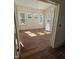 Bright, empty room with hardwood floors and multiple windows at 1101 Sunset Ave, Rocky Mount, NC 27804