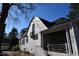 Charming white brick home featuring unique architectural details and a cozy front porch at 1101 Sunset Ave, Rocky Mount, NC 27804