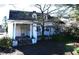 Charming two-story home with a columned front porch and mature tree at 1101 Sunset Ave, Rocky Mount, NC 27804