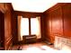 Cozy living room with wood paneled walls and a window at 1101 Sunset Ave, Rocky Mount, NC 27804