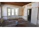 Living room under renovation featuring bay window and doorway at 1101 Sunset Ave, Rocky Mount, NC 27804