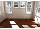 Bright living room featuring hardwood floors and large windows offering plenty of natural light at 1101 Sunset Ave, Rocky Mount, NC 27804