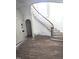 Elegant curved staircase with wooden banister and natural light at 1101 Sunset Ave, Rocky Mount, NC 27804