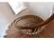 Unique spiral staircase with wooden steps and curved railing, light-filled at 1101 Sunset Ave, Rocky Mount, NC 27804