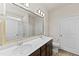 Stylish bathroom features double sinks, a large mirror, and modern fixtures at 115 Dolomite Dr, Gibsonville, NC 27249