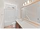 Bright bathroom with tub/shower, large mirror and vanity with storage at 115 Dolomite Dr, Gibsonville, NC 27249