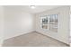 Bright bedroom with neutral carpet, fresh white paint and large window at 115 Dolomite Dr, Gibsonville, NC 27249