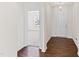 Bright entryway with hardwood floors, leading into carpeted living space at 115 Dolomite Dr, Gibsonville, NC 27249