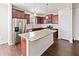 Well-appointed kitchen with island, stainless steel appliances, and ample cabinet space at 115 Dolomite Dr, Gibsonville, NC 27249