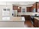 Stylish kitchen featuring an island with granite countertops, stainless appliances, and wood cabinets at 115 Dolomite Dr, Gibsonville, NC 27249