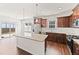 Modern kitchen with stainless steel appliances, granite countertops, and wooden cabinets at 115 Dolomite Dr, Gibsonville, NC 27249
