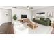 Bright living room featuring stylish furniture and a large TV for entertainment at 115 Dolomite Dr, Gibsonville, NC 27249
