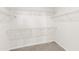Walk-in closet with wall-mounted metal racks for organization and storage at 115 Dolomite Dr, Gibsonville, NC 27249