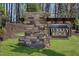 Stone monument sign with a dark sign for Turkey Ridge community at 120 Gobbler Dr, Smithfield, NC 27577