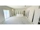 Spacious living room with white walls, sliding glass door, and a cutout for base cabinet install at 120 Gobbler Dr, Smithfield, NC 27577