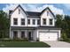 Charming two-story home with a two-car garage, symmetrical window placement, and a manicured front lawn at 121 Moonflower Ln # Homesite 258, Clayton, NC 27520