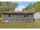A spacious backyard features green siding and a well-maintained lawn at 1213 Freeman Dr, Sanford, NC 27330