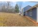 Exterior view showcases the home's backyard with a well-maintained lawn and landscaping at 12507 N Roxboro St, Rougemont, NC 27572
