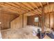 Unfinished basement with wooden beams, offering a customizable space for storage or renovation at 12507 N Roxboro St, Rougemont, NC 27572