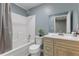 Bathroom featuring a shower-tub combo and a vanity with cabinet storage at 12507 N Roxboro St, Rougemont, NC 27572