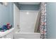Bathroom with a shower/tub combination and floral shower curtain at 12507 N Roxboro St, Rougemont, NC 27572