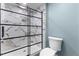 Bathroom showcasing marble tiled shower with sliding glass door at 12507 N Roxboro St, Rougemont, NC 27572