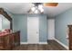 Bedroom features wood floors, closet and a decorative mirror on dresser at 12507 N Roxboro St, Rougemont, NC 27572