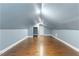 Spacious bedroom featuring hardwood floors, ample lighting, and a convenient closet at 12507 N Roxboro St, Rougemont, NC 27572