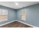 Bedroom with hardwood floors and large windows at 12507 N Roxboro St, Rougemont, NC 27572
