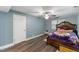 Bedroom features wood floors, a window and a ceiling fan at 12507 N Roxboro St, Rougemont, NC 27572