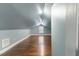 Bright bedroom with sloped ceilings, hardwood floors, and a well-lit window at 12507 N Roxboro St, Rougemont, NC 27572