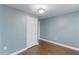 Bedroom with a door and wood-look flooring at 12507 N Roxboro St, Rougemont, NC 27572