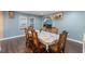 Well-lit dining area boasts hardwood floors, an open layout, and access to living spaces at 12507 N Roxboro St, Rougemont, NC 27572