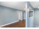 Hallway with wood-look flooring and light blue-grey walls at 12507 N Roxboro St, Rougemont, NC 27572
