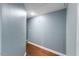 Hallway with wood floors and light grey-blue walls at 12507 N Roxboro St, Rougemont, NC 27572