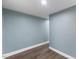 Hallway with modern hardwood flooring and neutral wall color at 12507 N Roxboro St, Rougemont, NC 27572